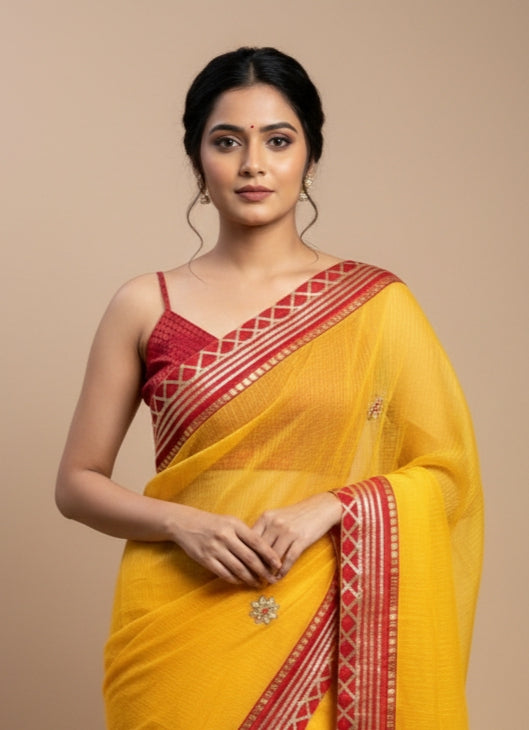 yellow Bandhani saree with golden detailing